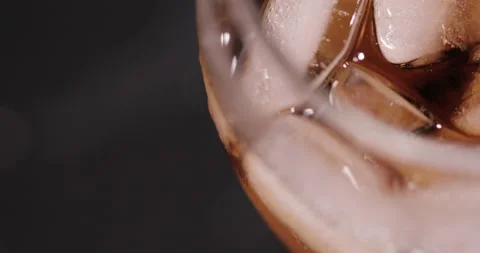 Ice cubes in a glass with cola Stock Footage 133594759