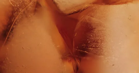 Ice cubes in a glass with cola Stock Footage 133595391