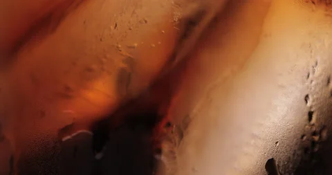 Ice cubes in a glass with cola Stock Footage 133595895