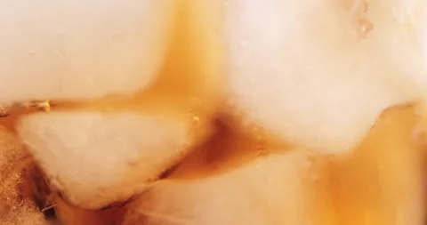 Ice cubes in a glass with cola Stock Footage 133596807