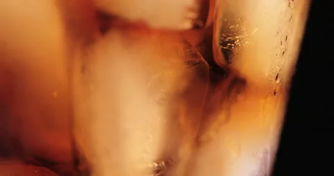 Ice cubes in a glass with cola Stock Footage 133597502
