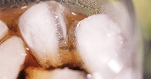 Ice cubes in a glass with cola Stock Footage 133601031