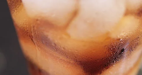 Ice cubes in a glass with cola Stock Footage 133601371
