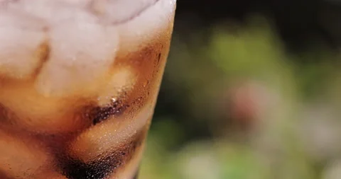 Ice cubes in a glass with cola Stock Footage 133602274