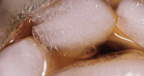 Ice cubes in a glass with cola Stock Footage 133603129