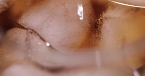 Ice cubes in a glass with cola Stock Footage 133603566