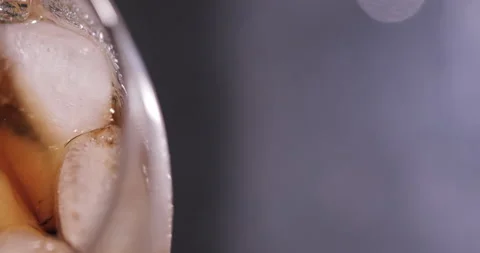 Ice cubes in a glass with cola Stock Footage 133605151