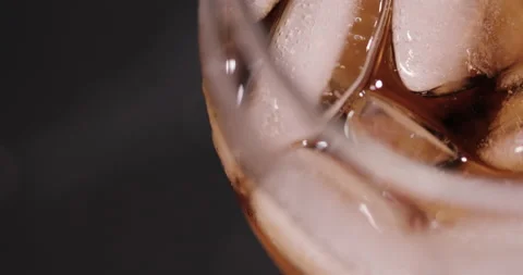 Ice cubes in a glass with cola Stock Footage 133605790