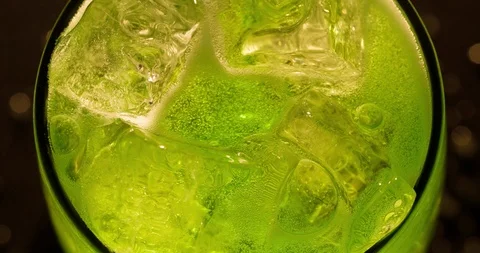 Ice cubes in Glass with Green Soda Mojito Macro closeup Top view Stock Footage 125375853