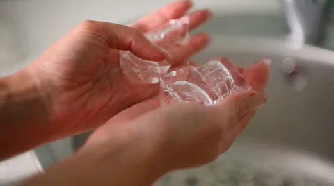 Ice cubes in his hands Stock Footage 1184042