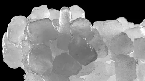 Ice cubes melting on black background. Ultra HD time lapse at 60pfs Stock Footage 100611259