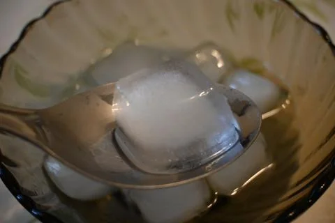 Ice Cubes on Plate Close-Up, Cooling and Heat Relief Concept Stock Photos