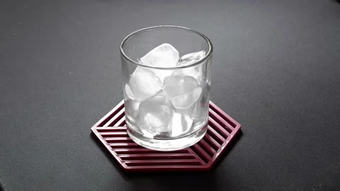 Ice cubes put in a glass Stock Footage 236848981