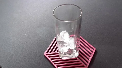 Ice cubes put in a glass Stock Footage 236849030