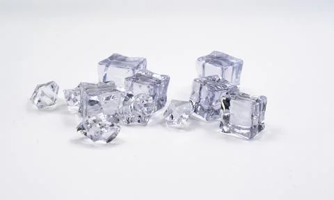 Ice cubes with reflection against white background Stock Photos