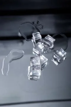 Ice cubes on a reflective surface Stock Photos
