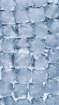 Ice cubes on a silver backdrop. Cold winter texture background Stock Photos