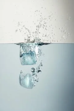 Ice cubes splash Stock Photos