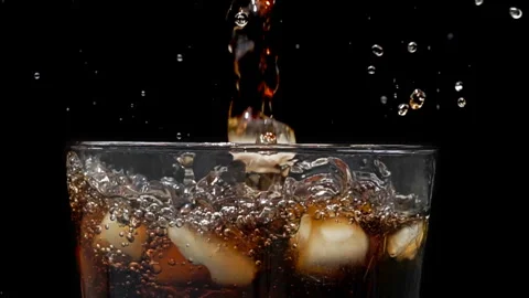 Ice Cubes Splashing into Cola Glass, Slow Motion Stock Footage 346088196