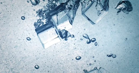 Ice cubes splashing in sparkling water, abstract cold background. Stock Footage 343406268