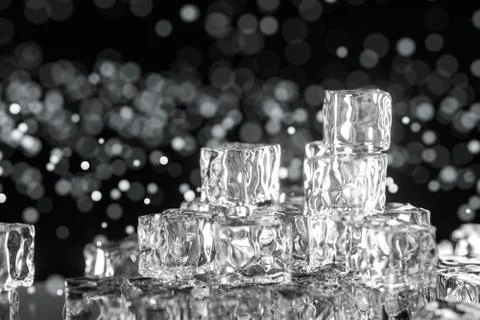 Ice cubes stacked each other with black background, 3d rendering. イラスト素材