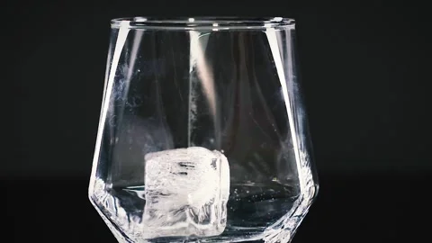 Ice Cubes Stacking in a Clear Glass Stock Footage 305899885