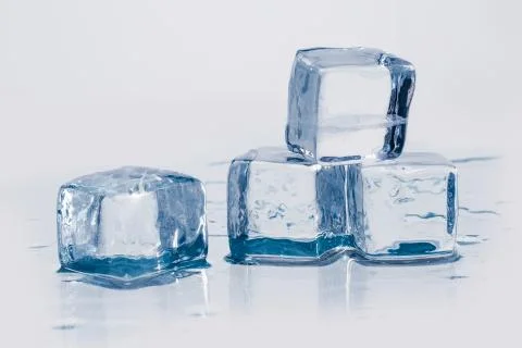 Ice cubes on table Fotos Stock