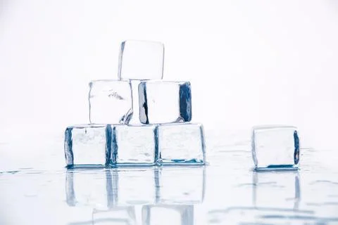 Ice cubes on table Stock Photos