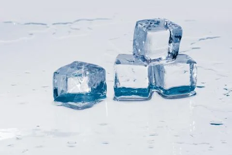 Ice cubes on table Stock Photos