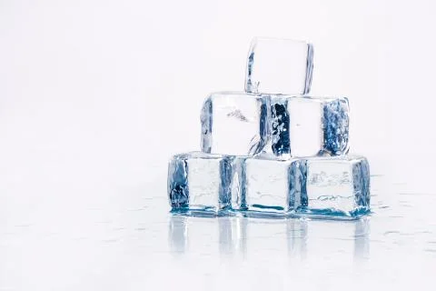 Ice cubes on table Фото