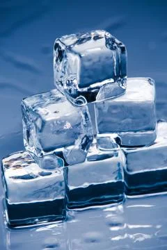 Ice cubes on table Stock Photos