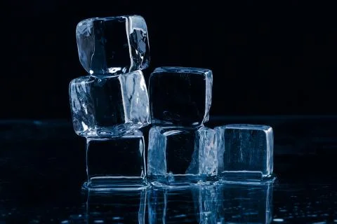 Ice cubes on table Stock Photos