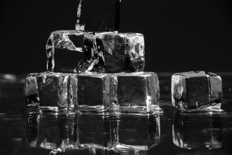 Ice cubes on table Stock Photos