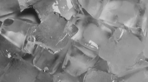 Ice cubes turning slowly on a table, close up Video stock 51850896