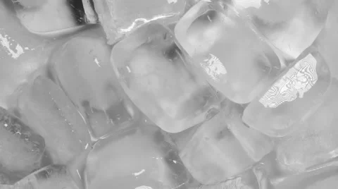 Ice cubes turning slowly on white background, close up Vídeo Stock 51852562
