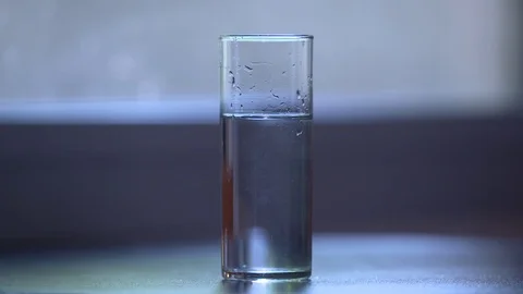 Ice cubes in water slow motion Stock Footage 70329364