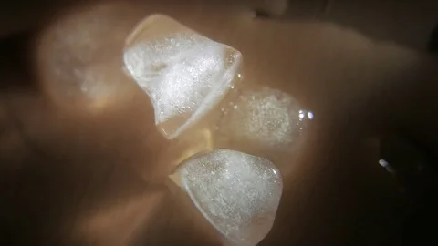 Ice cubes on a wet surface. 4K UHD Stock Footage 73340847