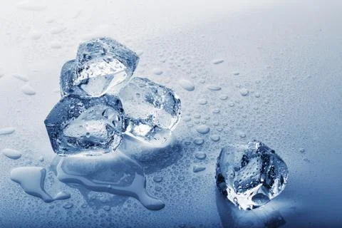 Ice cubes on wet table Stock Photos