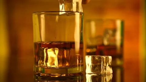 Ice Cubes in Whiskey Glass Stock Footage 88923505