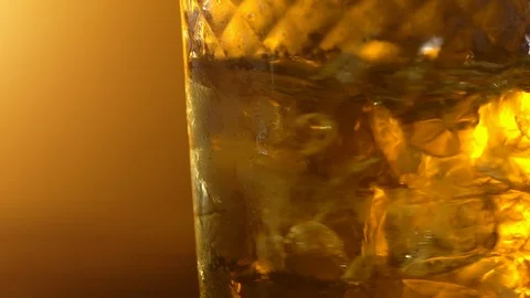 Ice cubes in a whisky Stock Footage 107921753