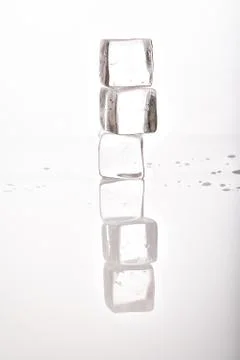 Ice cubes on white background Stock Photos