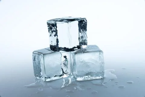 Ice cubes on white background.. Stock Photos