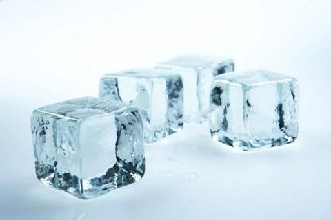 Ice cubes on white background.. Stock Photos