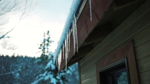 Ice Dams on a Rooftop Surrounded by Forest Video stock 322120549