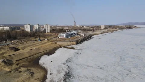 Ice Drift Occurs on the River next to the River Station Stock Footage 194345131
