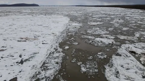 Ice Drift Occurs on the River next to the Island cover Forest Mountains Ridge Stock Footage 194345297