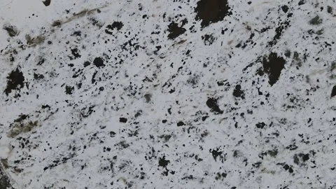 Ice Drift Occurs on the River next to a Island with Forest, Aerial view above Stock Footage 194345386