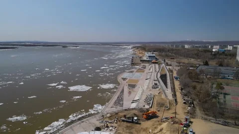 Ice Drift Occurs on a River next to the River Station in City Stock Footage 194345569