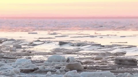 Ice drift with the red horizon background. Static closeup of evening landscape Stock Footage 75002881
