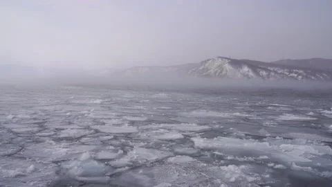Ice drift on the river. 4K UHD. Ice flowing down River in winter. 4K, UHD. Stock Footage 170593400